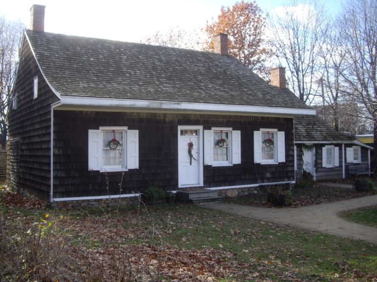 This is an image of the Wyckoff House in New York City on a sunny day, one of the oldest historical houses in New York.