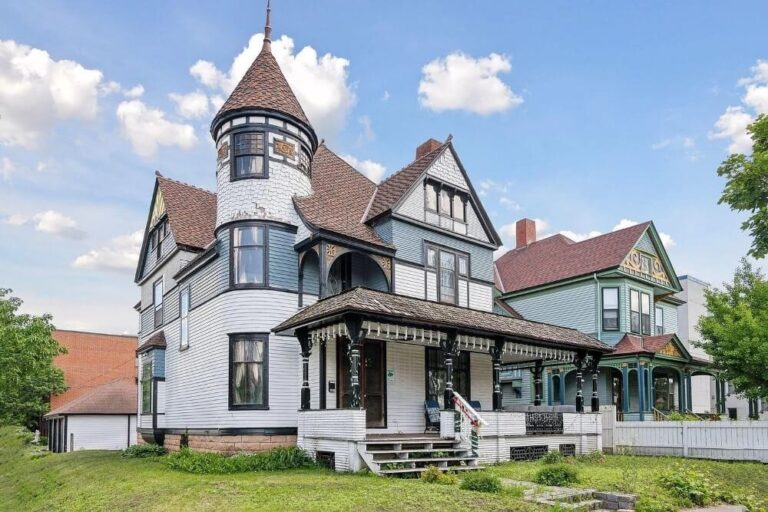 Exterior view of the Harry F. Legg House showcasing its historic architecture, elegant facade, and scenic city skyline backdrop